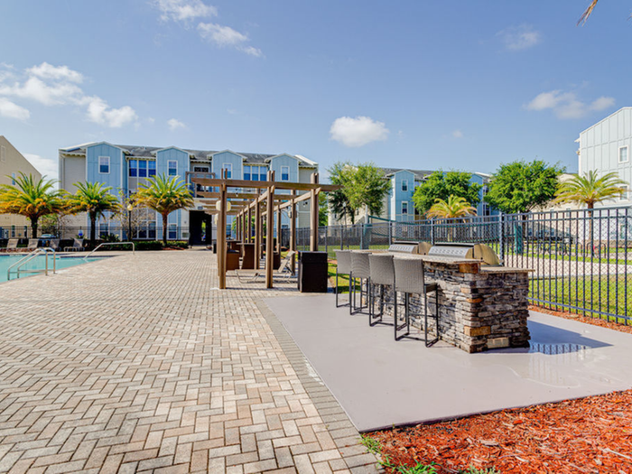 BBQ grilling station adjacent to sun deck - pool area  | Hawks Landing | Apartments in Tampa, FL