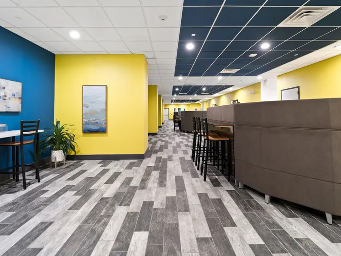 Clubhouse seating and common area at The Printing House | Binghamton Apartments