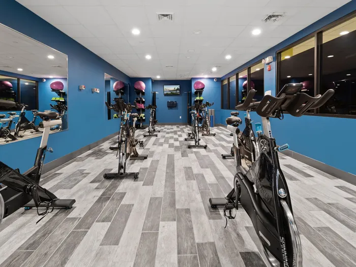 Fitness center with exercise equipmentat The Printing House | Binghamton Apartments