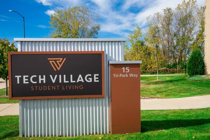 Close-up of outdoor sign | 	Tech Village | Student Apartments Appleton