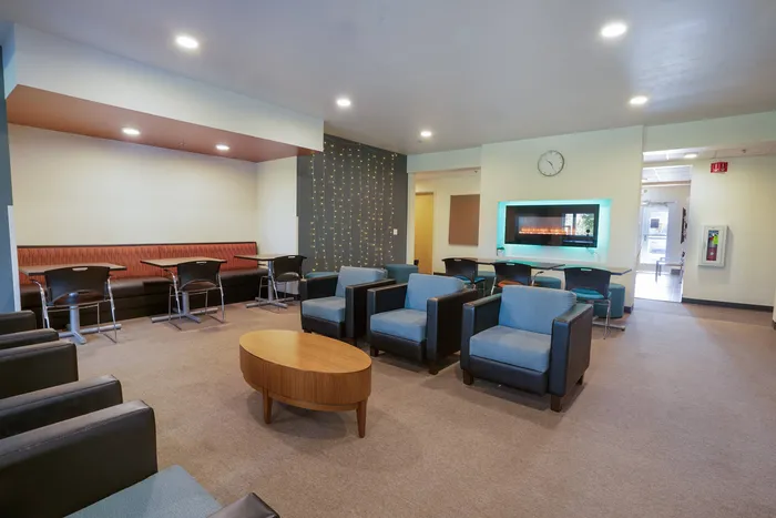 Clubhouse with fire feature at Tech Village | Appleton Apartments