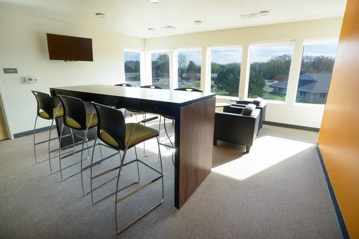 Lounge area with seating and TV at at Tech Village | Appleton Apartments