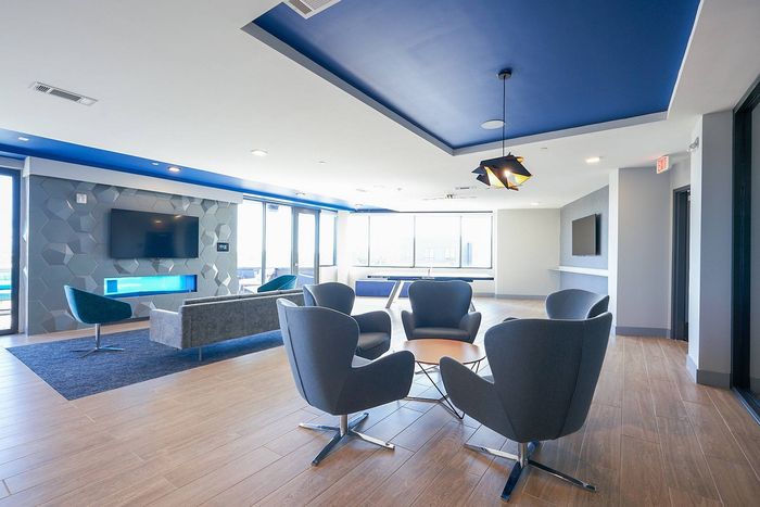Seating and Flat-Screen TV in Spacious Resident Club House | Bixby Kennesaw | Kennesaw Apartments Near KSU