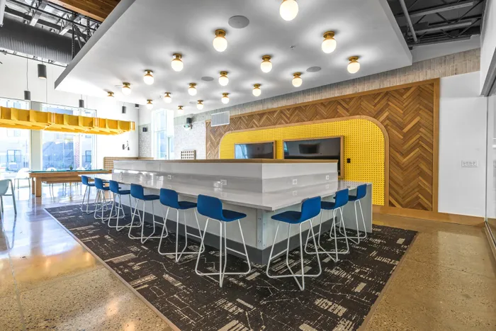 Seating & coffee bar in clubhouse  at Merced Station apartments Clubhouse 9|22