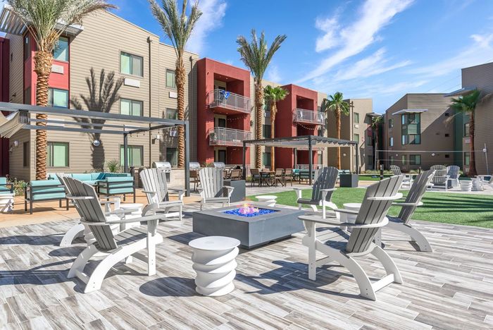 Fire feature and seating in outdoor community area  at Merced Station apartments