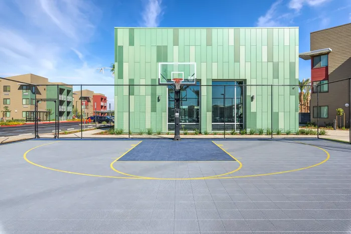 Outdoor basketball court  at Merced Station apartments.