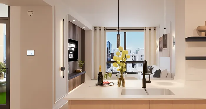 Elegant modern kitchen with sleek countertops, stylish lighting, and a cityscape view, perfect for entertaining.