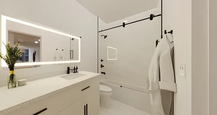 Elegant bathroom featuring modern fixtures, sleek vanity with under-mount sink, and illuminated mirror enhancing a pristine, contemporary design.