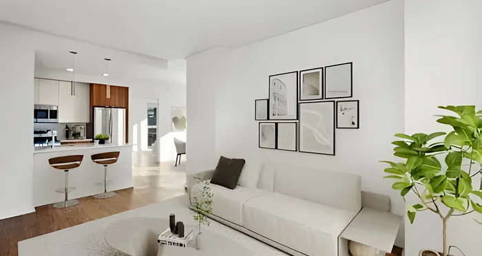 Modern living room with cozy sofa, stylish wall art, and a sleek, open-concept kitchen featuring a breakfast bar and contemporary lighting.