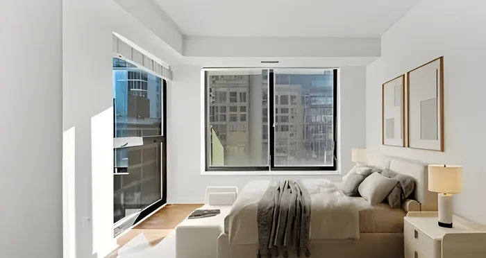 Bright and modern bedroom with large windows offering stunning city views, elegant decor, and cozy furnishings.