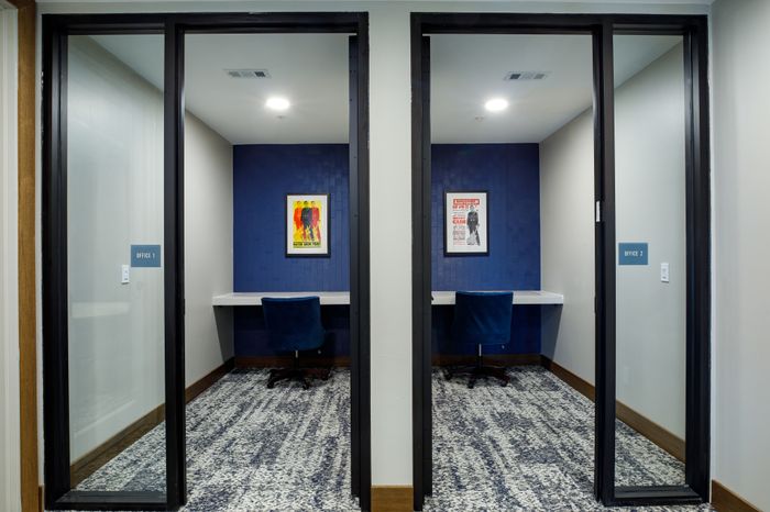 Private workroom with Wi-Fi at Wheatfield Village Apartments: A quiet and well-equipped space for focused work, featuring reliable Wi-Fi connectivity and a comfortable work environment