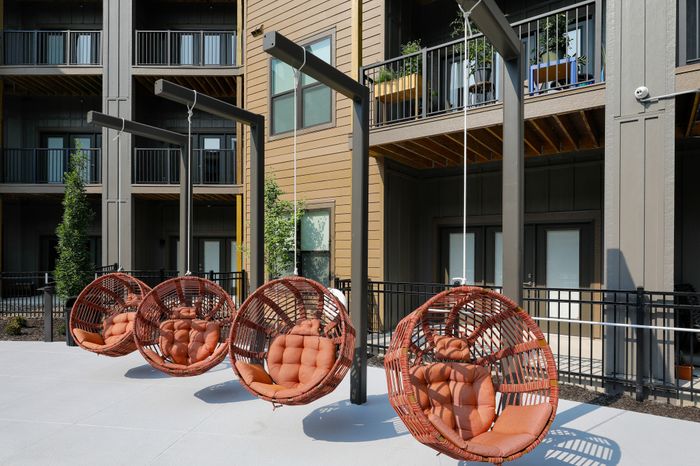 Hammock Swinging Chair in Courtyard of Wheatfield Village Apartments, Topeka, KS