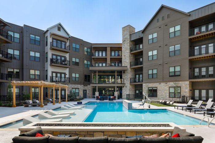 Relaxing atmosphere at the Courtyard Pool in Wheatfield Village Apartments, Topeka, KS.