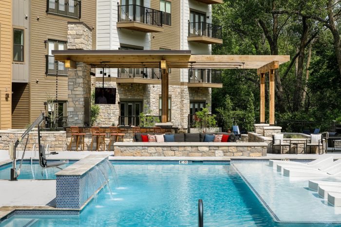Relaxing atmosphere at the Courtyard Pool in Wheatfield Village Apartments, Topeka, KS.