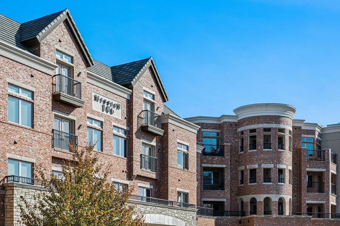 Exterior Image of Community Showcasing Beautiful Brick Facade and Rotunda - An exterior shot of the community featuring a beautiful brick facade and an impressive rotunda entrance.