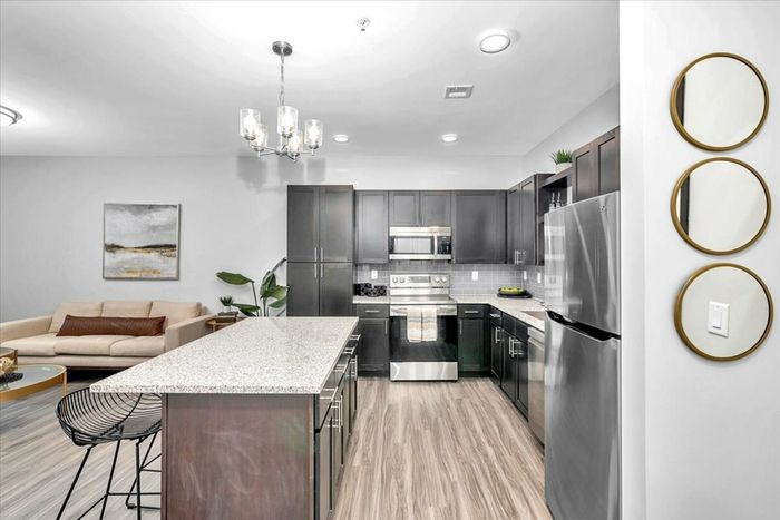 Charming 1-Bedroom Apartment - Sixty16 Apartments Shawnee, KS: Interior view of a charming 1-bedroom apartment at Sixty16 Apartments in Shawnee, KS, featuring modern design and amenities.