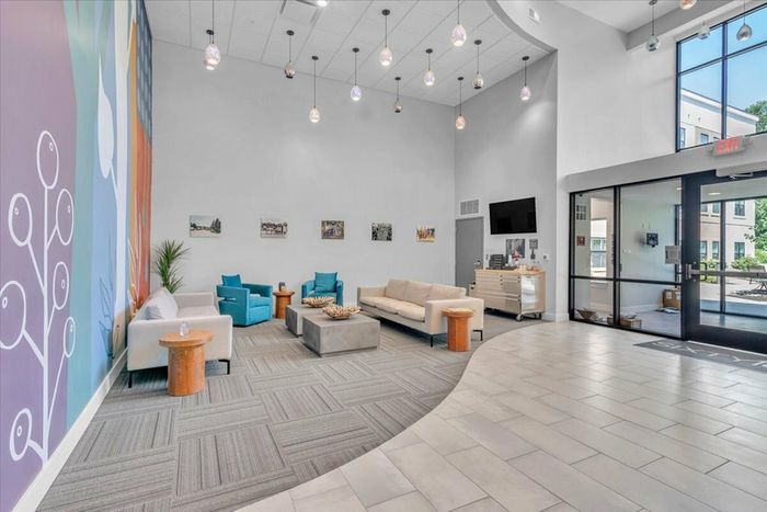 Elegant Lobby at Sixty16 Apartments Shawnee, KS: Stylish and elegant lobby area of Sixty16 Apartments, welcoming residents and guests in Shawnee, KS.