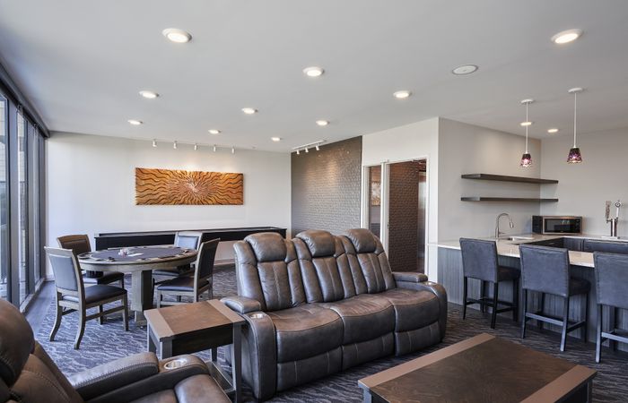 Modern living room with large windows and contemporary furniture