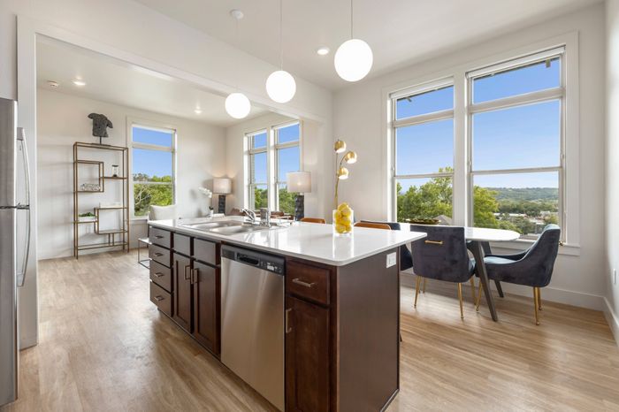 Tall Windows with views of the Boston Mountains