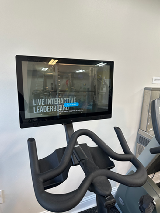 Modern exercise bike with live interactive leaderboard screen, perfect for engaging and dynamic home workouts.