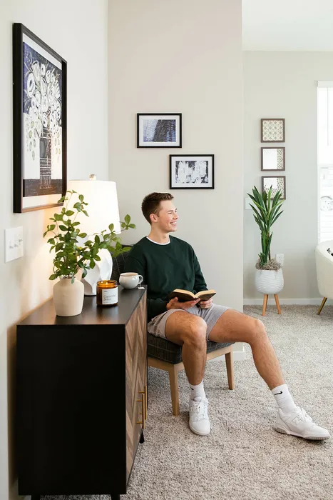 Resident In Living room | Crescent Woods Apartments | Apartments in Gahanna, OH