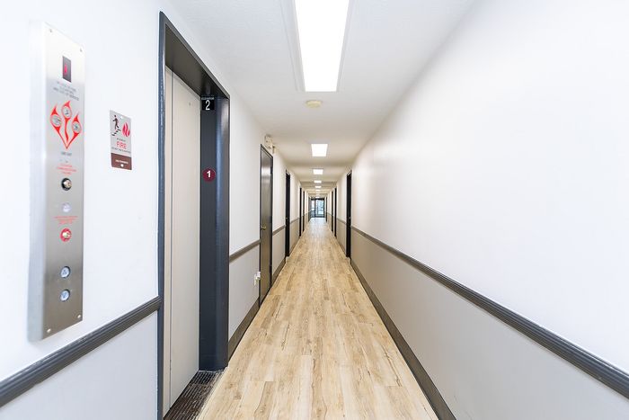 Washington Place Apartments - Long Hallway