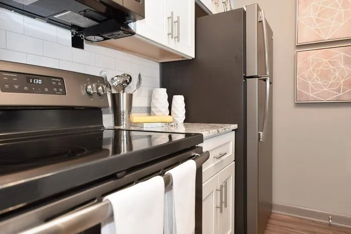 Kitchen with stainless appliances and granite counters