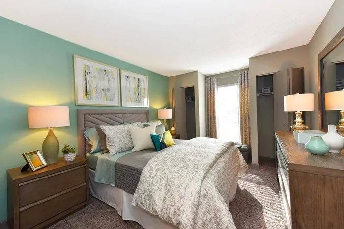 Bedroom with carpet and 2 closets