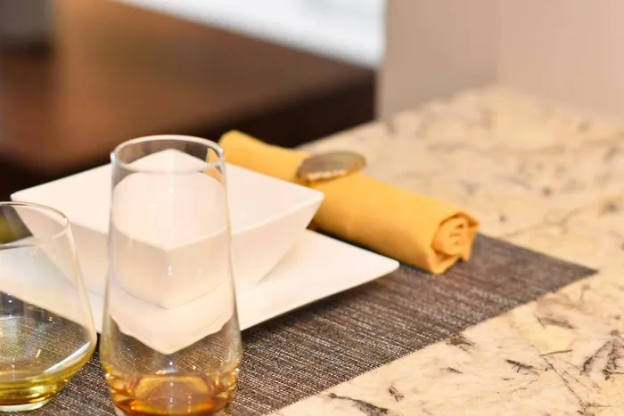 Kitchen closeup- granite counters and place mat setting