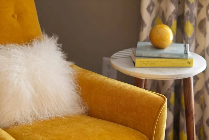 Living room decor- chair and side table with books