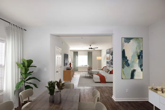 Bright and modern open-concept living room with stylish furniture and elegant decor.