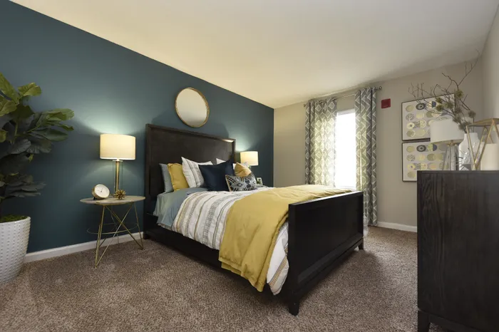Luxurious bedroom with a stylish bed, chic decor, and contemporary lighting.