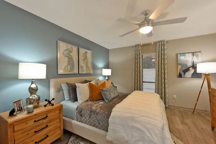 Elegant bedroom with plush bedding, modern decor, and serene lighting for a luxurious retreat.