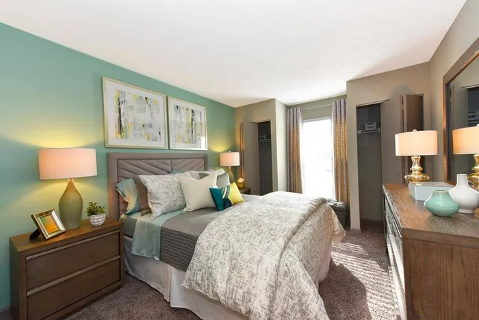 Bedroom with carpet and 2 closets