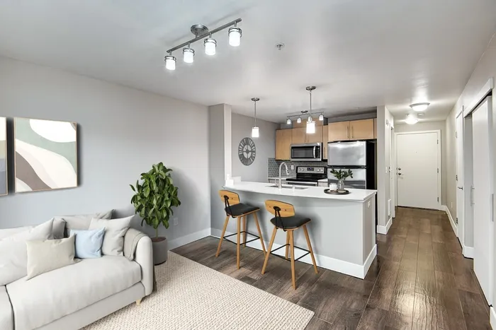 a kitchen with wooden cabinets and stainless steel appliances.
