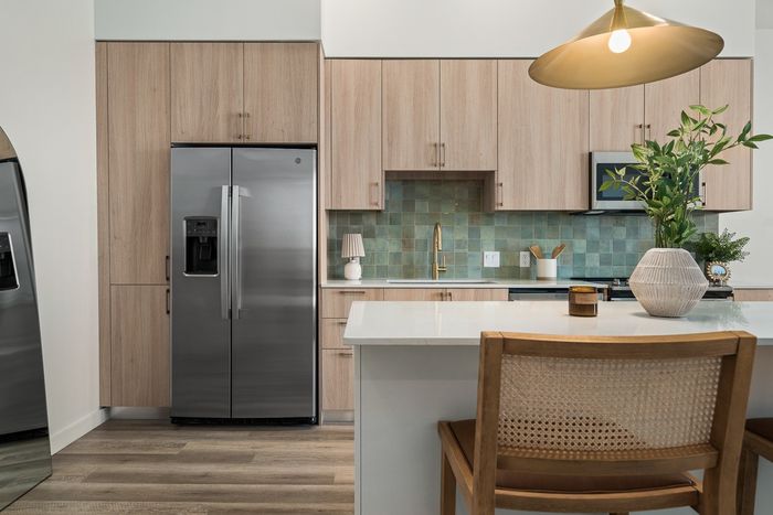 Model apartment home with fully equipped Kitchen with stainless steel appliance and  quartz countertops at Moontower Phoenix