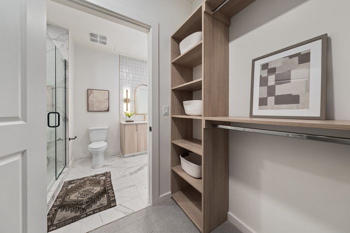 walk in closet and bathroom