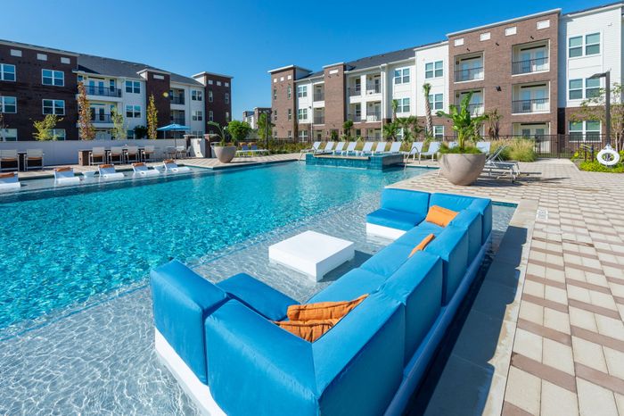 Resort-style pool with lounge seating