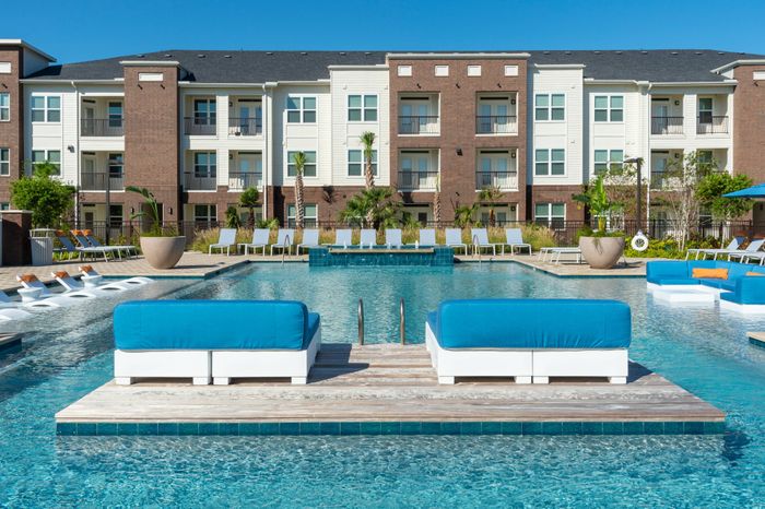 Resort-style pool with lounge seating