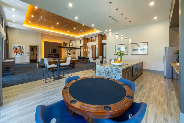 Resident lounge with full catering kitchen, poker table, and billiards