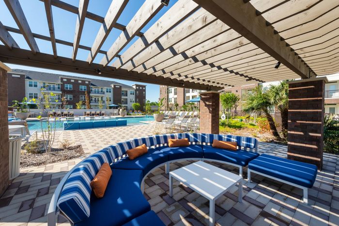 Resort-style pool with lounge seating