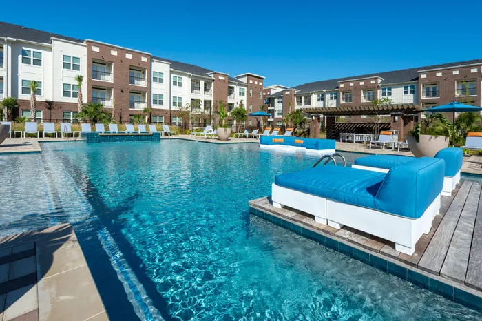 Resort-style pool with lounge seating