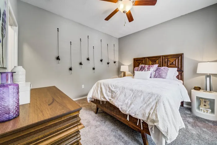 furnished bedroom with carpet