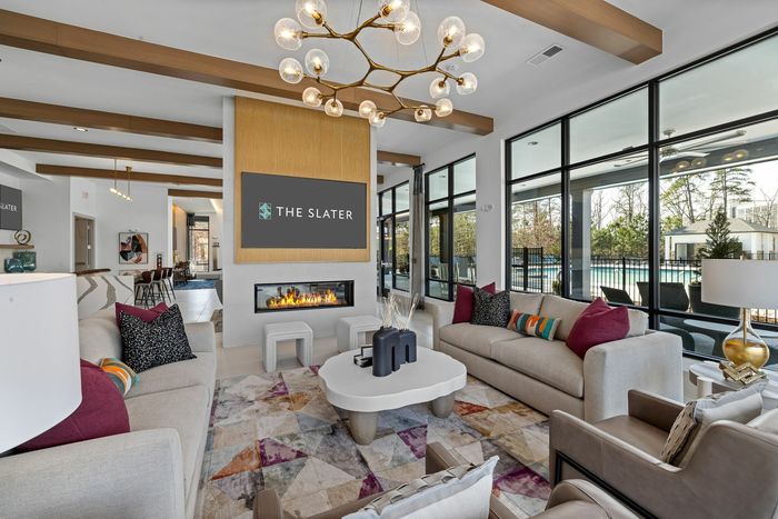 residential clubhouse with fireplace and large windows