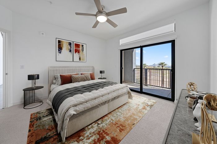Callia bedroom with outdoor patio, ceiling fan, carpet floors, furnished decor