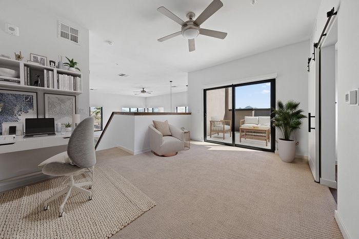 Callia upstairs study space, with ceiling fan, private balcony, carpet floors