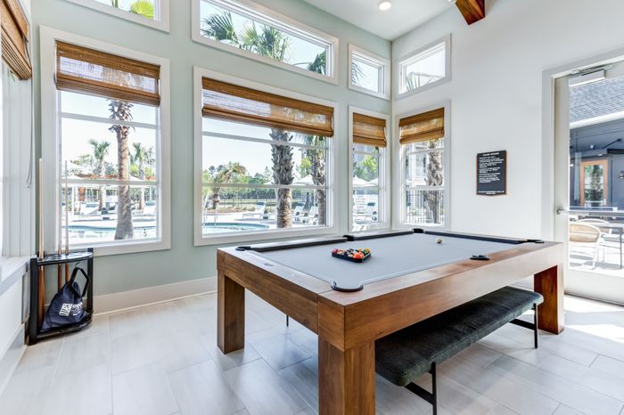 Room with pool table and seating