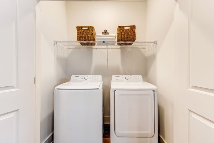 Side by side washer and dryer in laundry closest