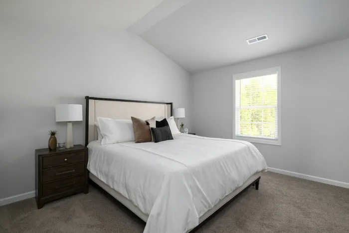 Bedroom with vaulted ceilings