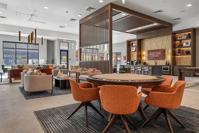 Interior clubhouse with lounge seating, ceiling lights